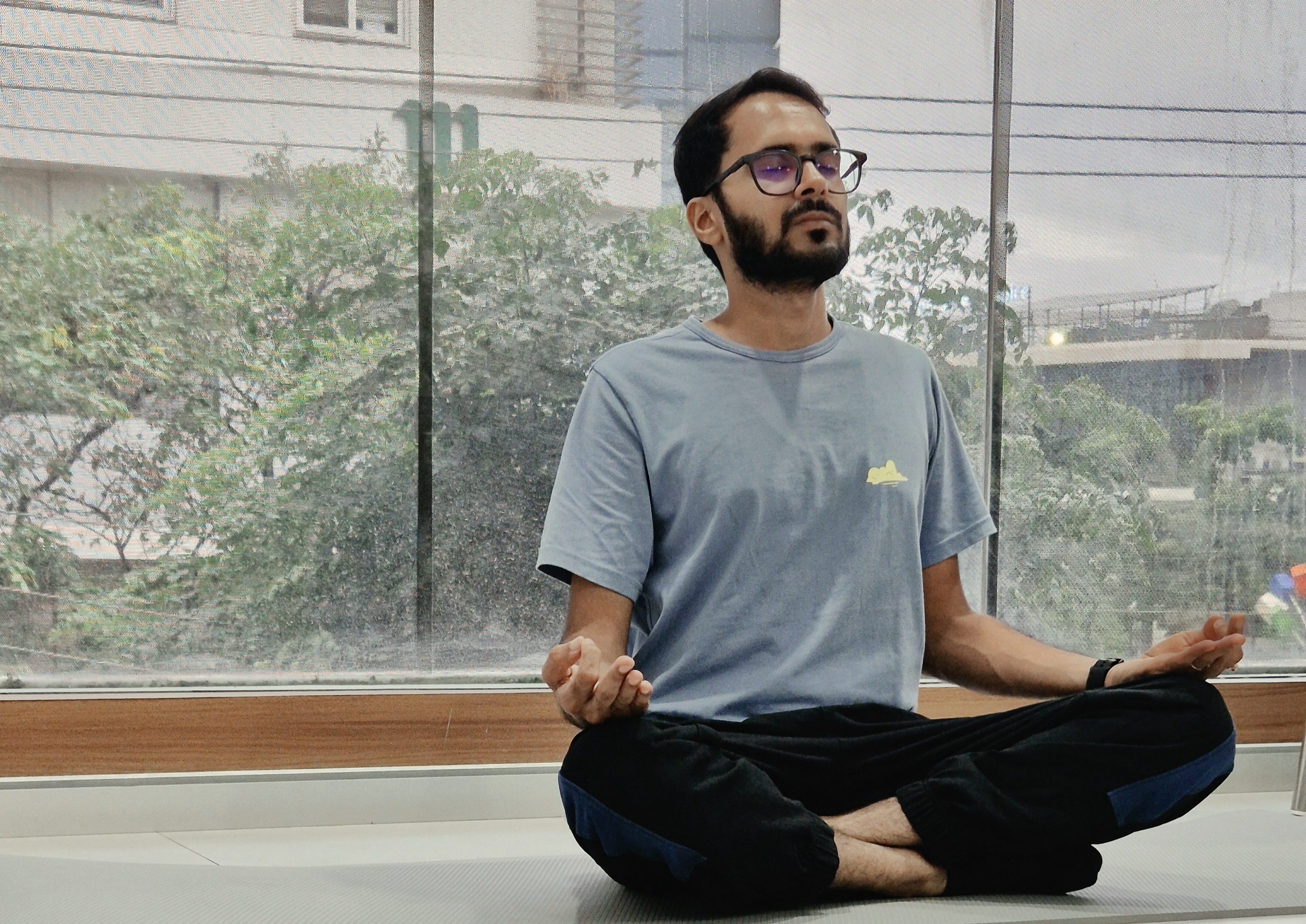 Gaurav Mishra, yoga trainer at AntarLaya Yogashala, demonstrating pranayama breathing